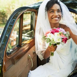 Shot of a bride being helped out of the backseat of a carhttp://195.154.178.81/DATA/i_collage/pu/shoots/784347.jpg